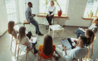 group of people sitting around a table