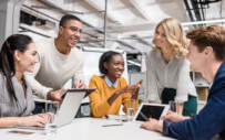 five people around a table