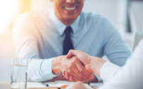 close up of two people shaking hands