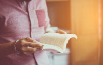 A college student takes on some summer reading.