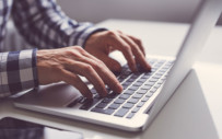 Man typing on laptop