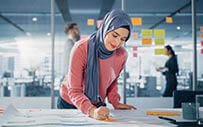 A woman works on a project.