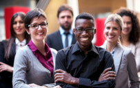 group of men and women smiling the picture