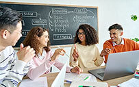 A group of interns in a brainstorming session.