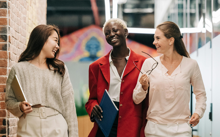 A group of women talking in the office.