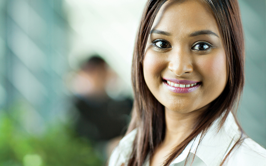 A female professional smiles.