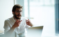 A career services professional works remotely to provide guidance to a student.