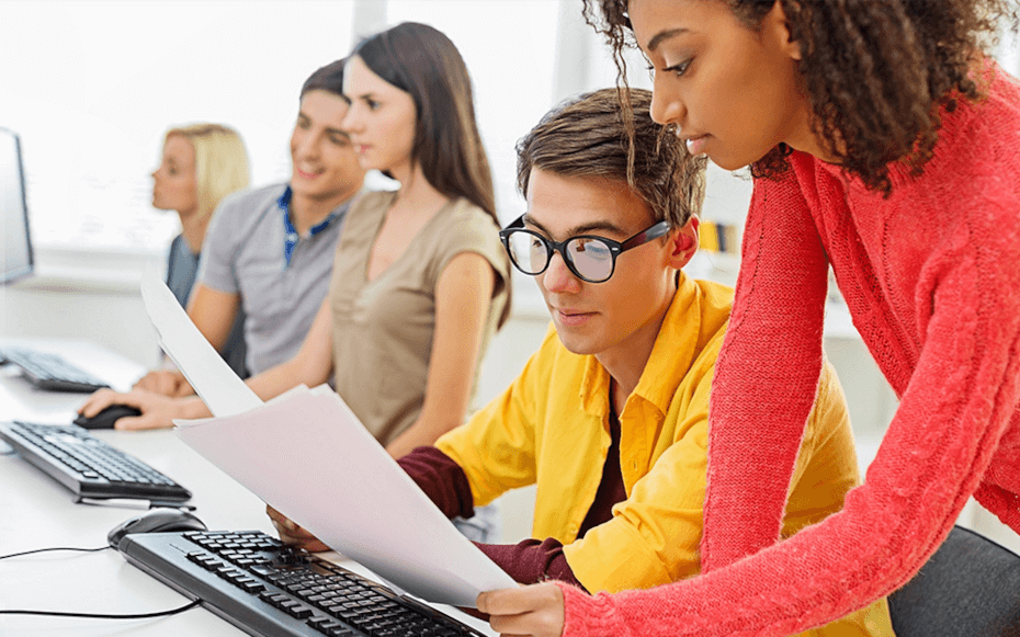 five people around a desk