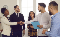 A group of recruiters welcome a group of interns to the office.