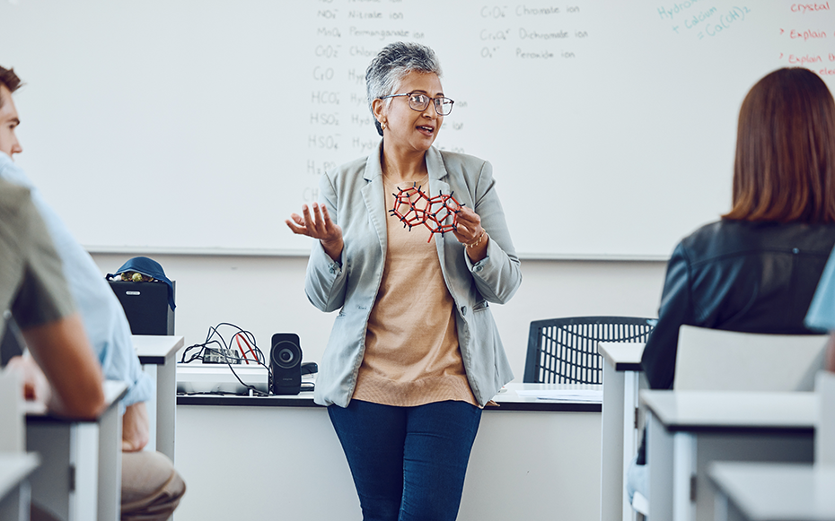 A professor teaches a college class.