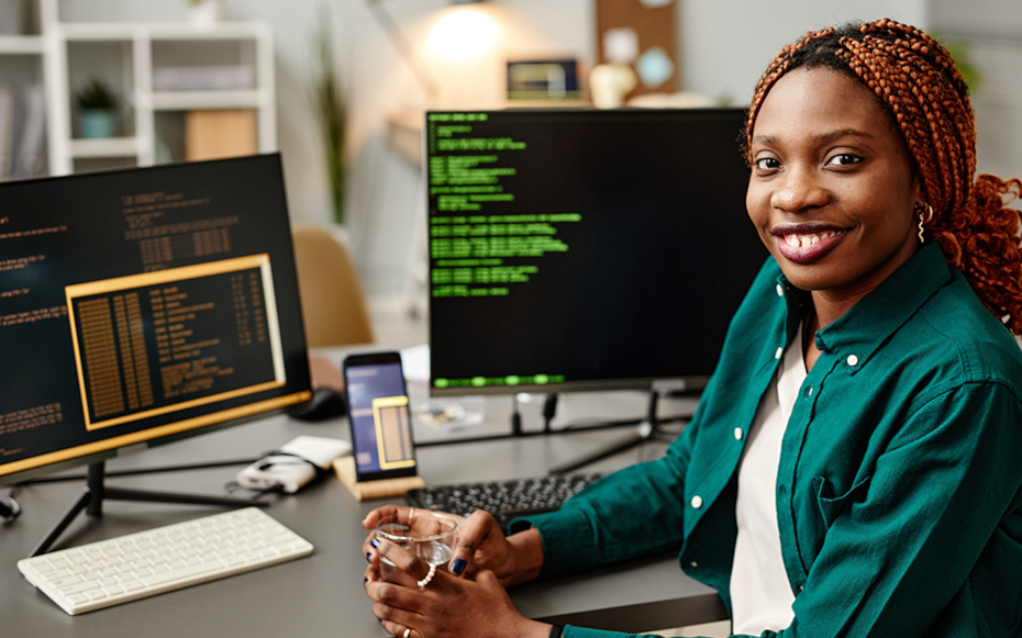 A student works are her computer.