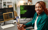 A student works are her computer.