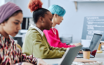 A group of students work on computers.